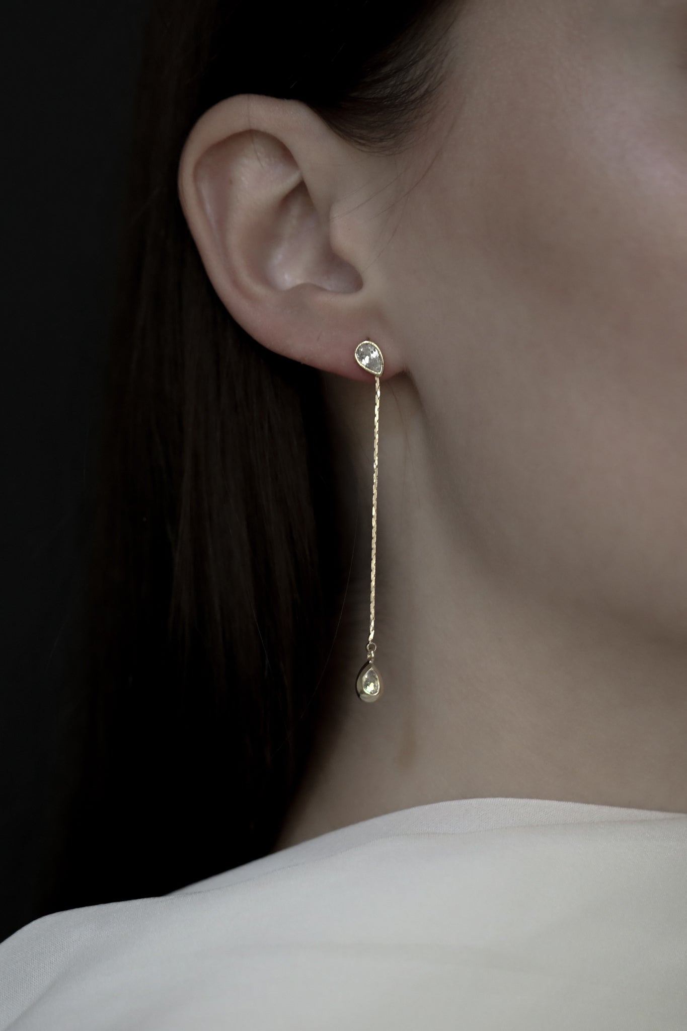 Gold Bezel Crystal Strand Earring on brunette model wearing a bridal neck scarf