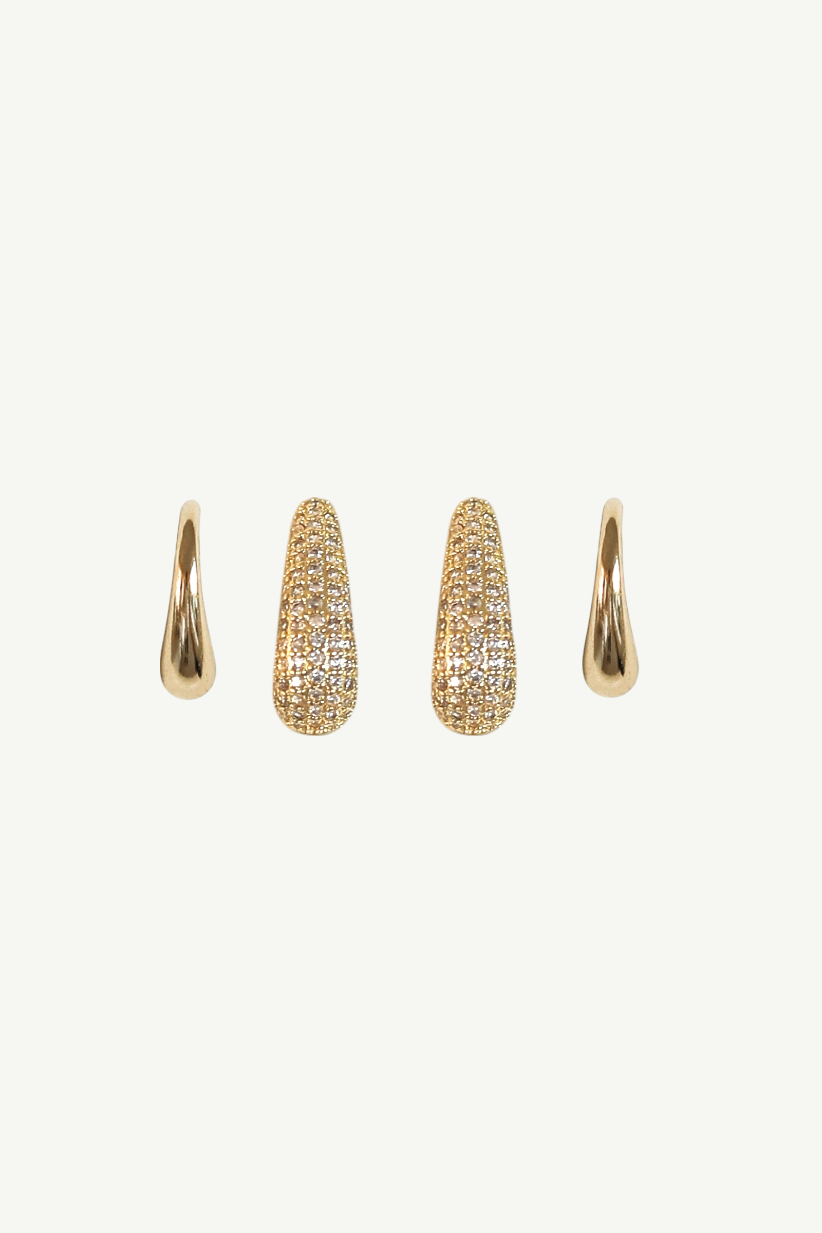 Set of gold pave stud earrings by Studio Bride on a white background