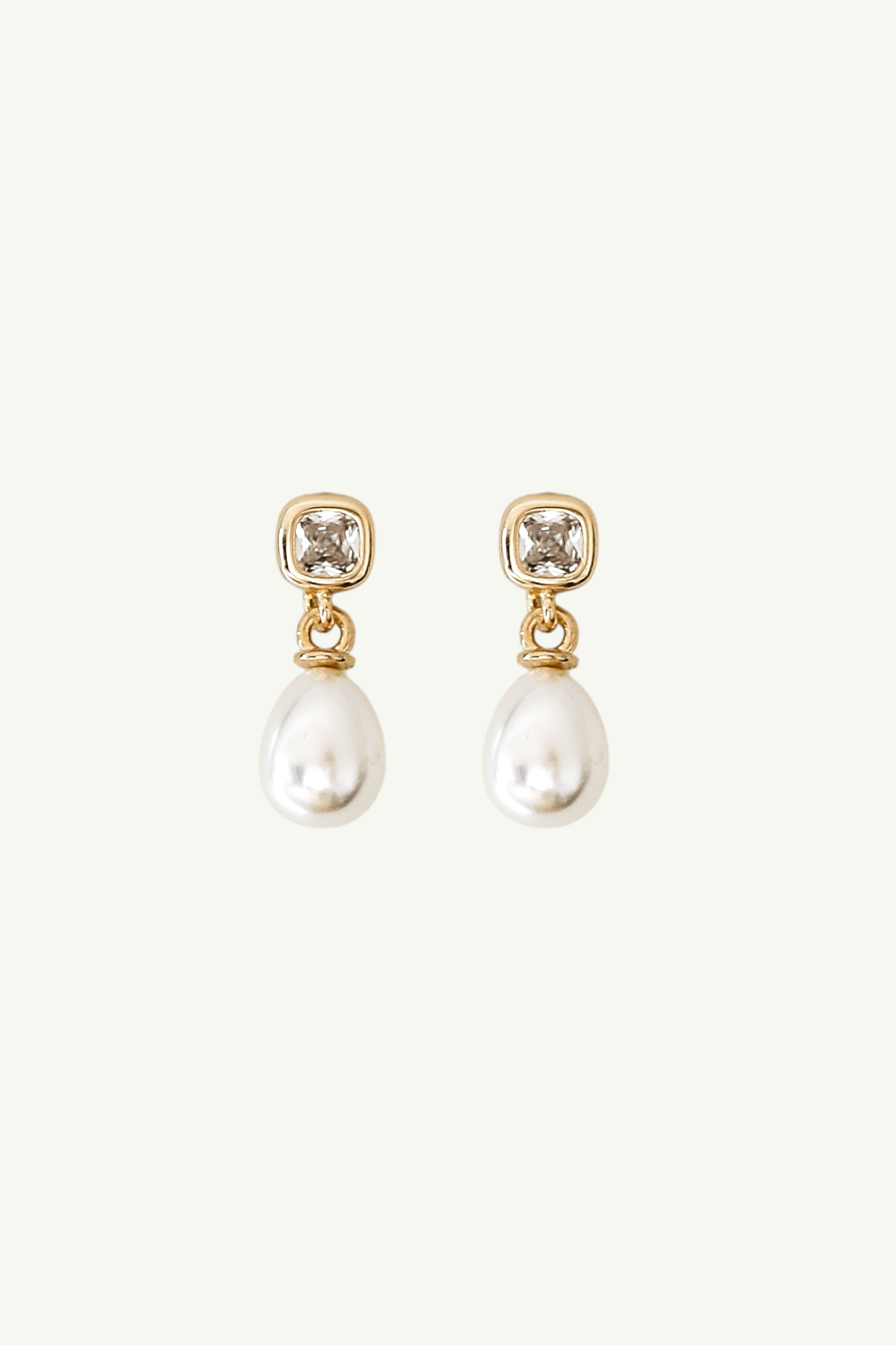 Flat image of gold micro bezel crystal bridal earring with classic pearl drop