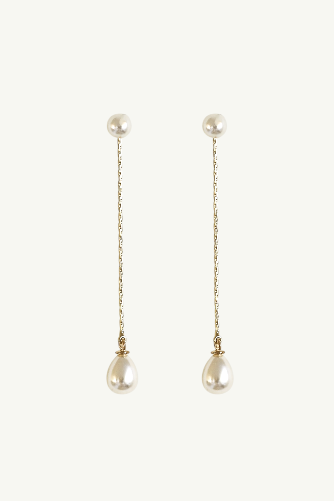 Pair of pearl strand earrings by Studio Bride Jewelry on a white background