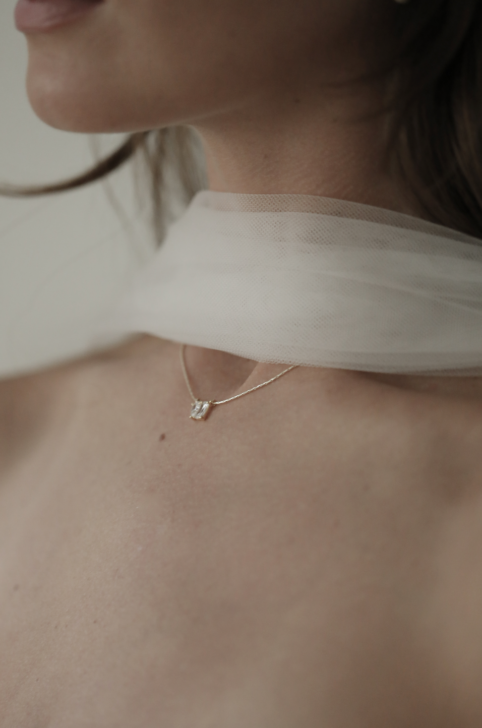 CZ pendant necklace by Studio Bride Jewelry worn by bride with silk scarf